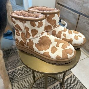 Cow print UGG boots.
